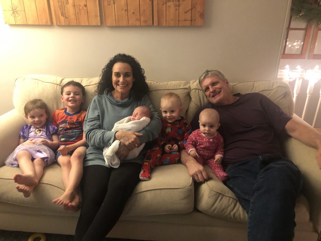 Steve & Debbie with their five grandkids.